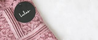 Pink lace fabirc with Lulu's clothes tag